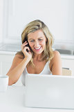 Woman using laptop during call with somebody