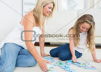 Mother and daughter doing a jigsaw