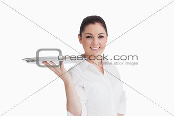 Smiling woman holding tray