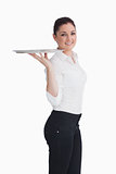 Waitress balancing silver tray