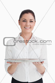 Waitress holding tray with two hands