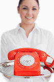 Close up of red telephone on tray