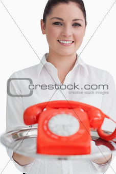 Smiling woman holding a tray