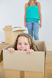 Laughing girl in moving box