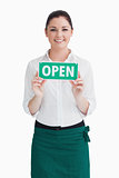 Waitress holding open sign