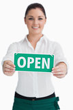 Waitress holding out open sign