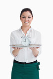 Waitress holding an alarm clock