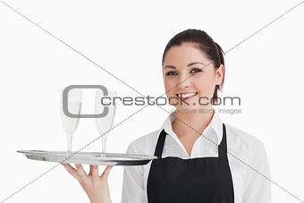 Waitress holding two glasses