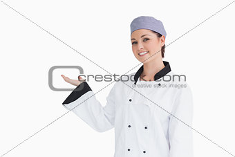 Happy chef showing something