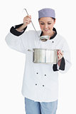 Smiling chef with pot and ladle