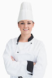 Smiling cook wearing a chef hat