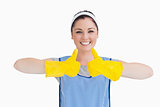 Cleaner woman thumbs up with yellow gloves