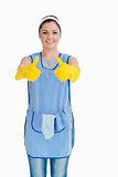 Cleaning woman giving thumbs up with yellow gloves