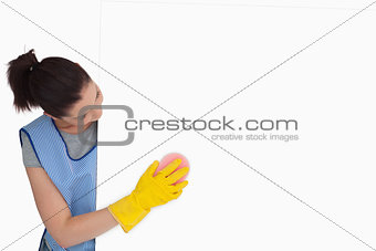 Maid washing with a sponge