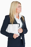 Business woman looking away with a clipboard