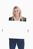Happy business woman showing a white panel
