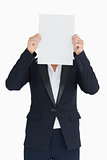 Business woman holding a white panel in front of her face