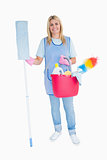 Cheerful maid holding a pink bucket and mop
