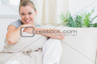 Cheerful woman holding a pillow