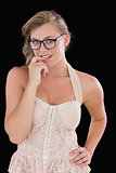 Woman with glasses chewing on finger