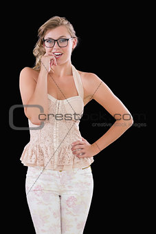 Woman in white chewing on nail