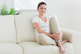 Smiling woman sitting in a living room