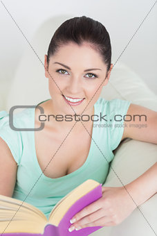 Woman sitting on the couch and reading