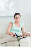 Reading woman sitting on the couch
