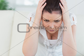 Annoyed woman sitting on the couch
