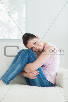 Relaxing woman sitting in a living room