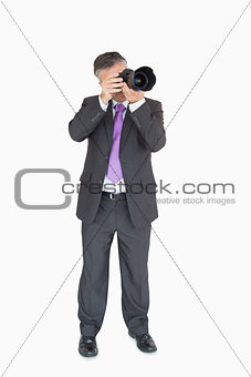 Business man using a camera