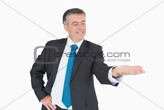 Happy businessman holding out hand