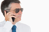 Man in suit and sunglasses on mobile phone