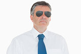 Stern businessman in sunglasses