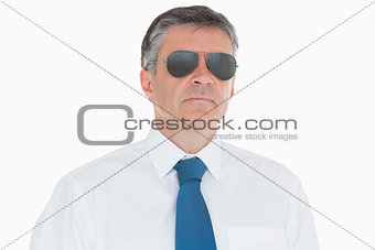Stern businessman in sunglasses