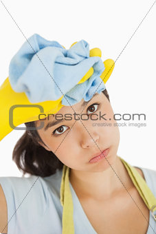 Woman wiping the sweat off her head