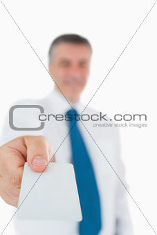 Businessman handing out card