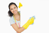 Cheerful woman cleaning white surface