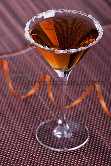 Gold cocktail in martini glass