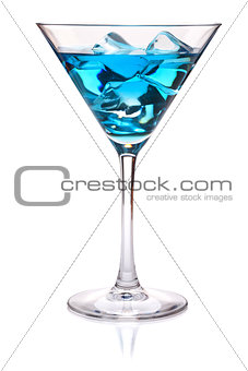 Blue tropical cocktail in martini glass