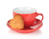 Red coffee cup and heart shaped cookie