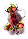 Refreshing fruit sangria in jug and two glasses