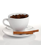 Coffee cup with beans and cinnamon