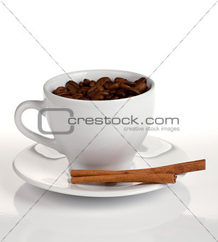 Coffee cup with beans and cinnamon