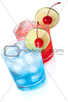 Two cocktails with lime slice and maraschino