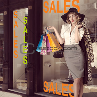 fashion portrait of kitsch shopping girl in front of window shop