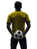 rear view back man holding soccer football silhouette