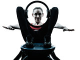 woman exercising pilates ring