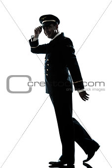 man in airline pilot uniform silhouette walking 