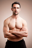 Fit Man Standing With Arms Crossed